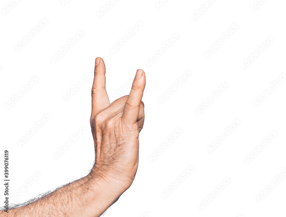 Hand of caucasian middle age man over isolated white background gesturing rock and roll symbol, showing obscene horns gesture Hand of caucasian middle age man over isolated white background gesturing rock and roll symbol, showing obscene horns gesture