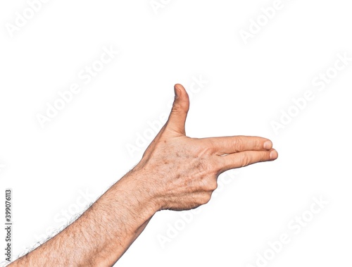 Hand of caucasian middle age man over isolated white background gesturing fire gun weapon with fingers  aiming shoot symbol