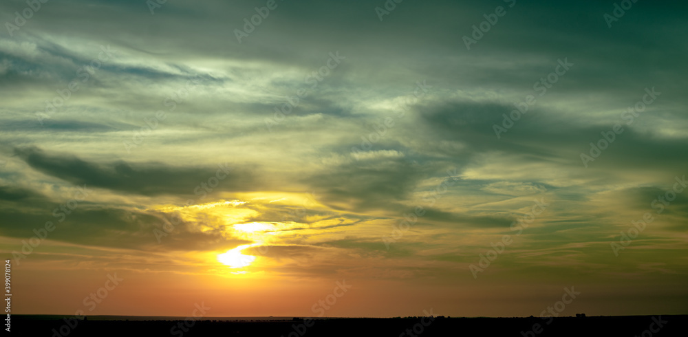 Naklejka premium Sunset in the Clouds