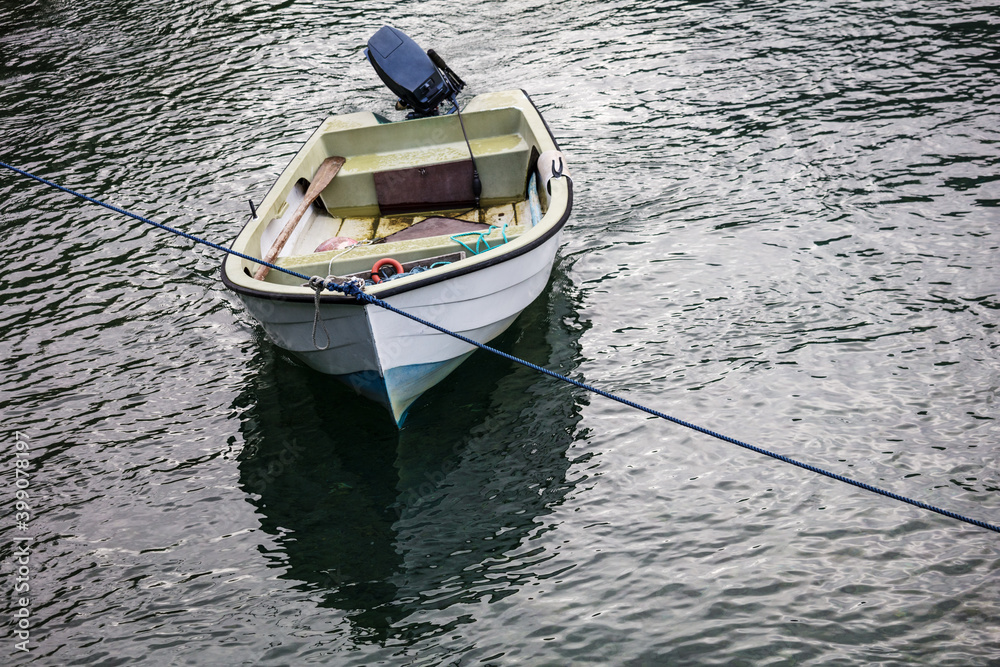 motor boat parked in calm water