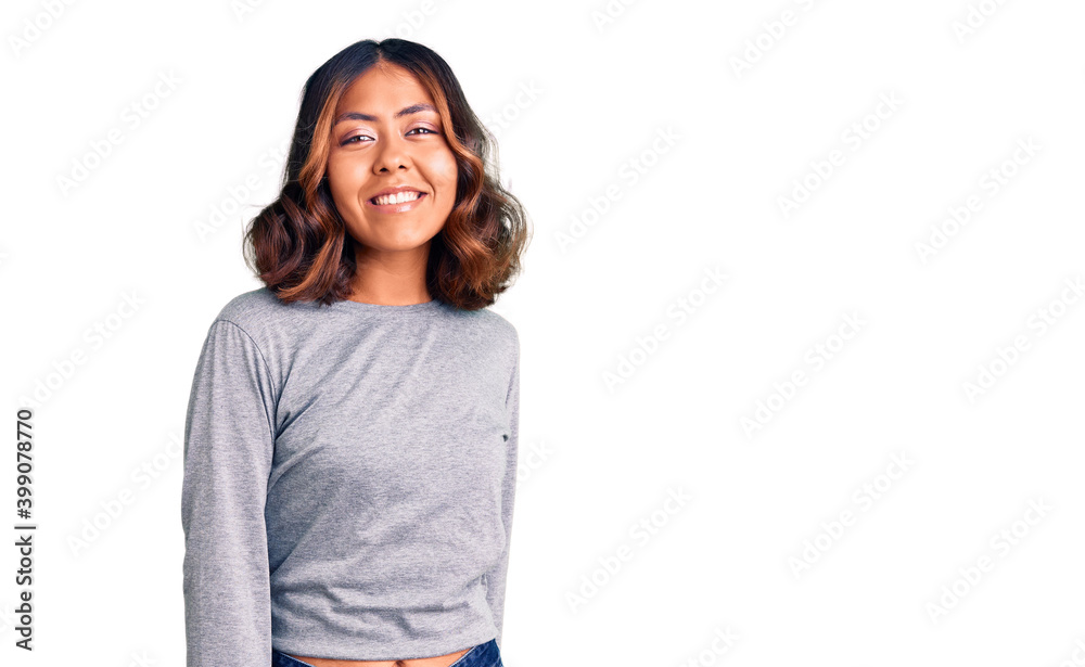Young beautiful mixed race woman wearing casual clothes looking positive and happy standing and smiling with a confident smile showing teeth