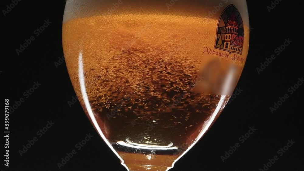turning glass with Belgian beer