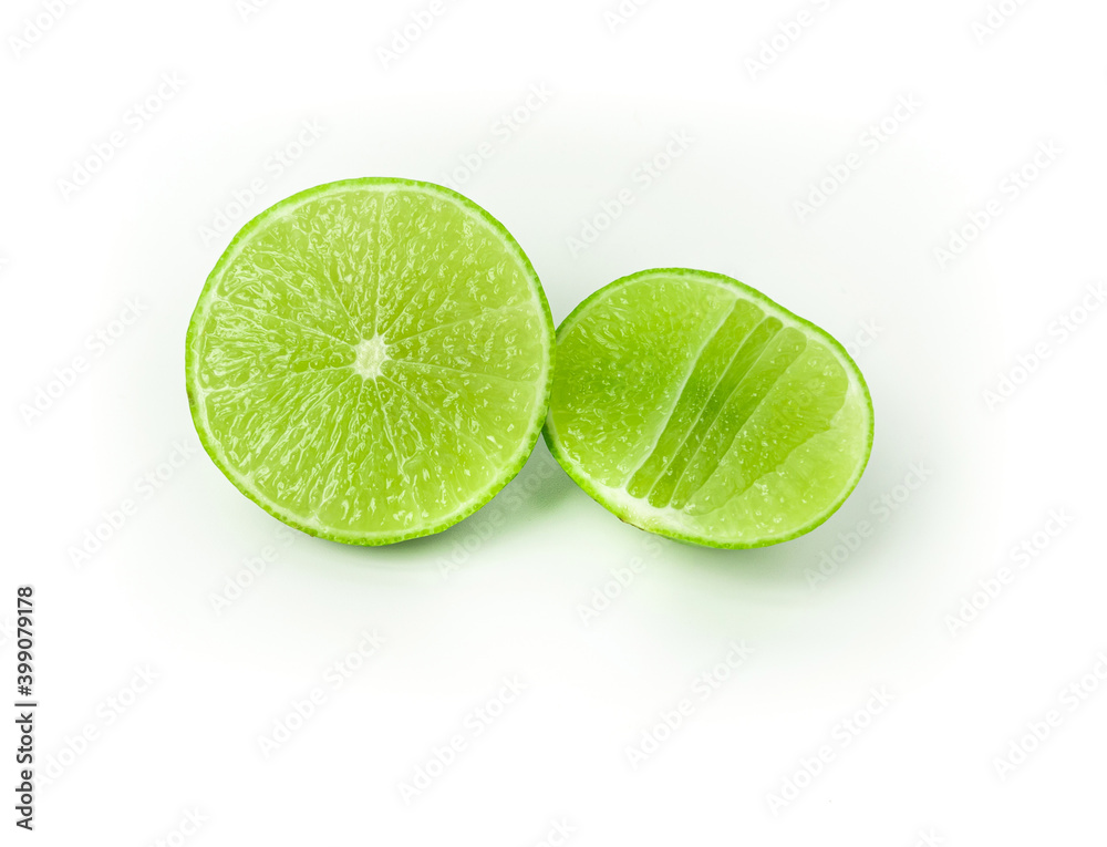 Ripe slice of green lime citrus fruit stand isolated on white background. Lime wedge. vegan food concept
