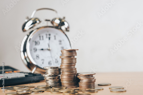 debt collection and tax season concept with deadline remind note, coins, banks, calculator on table, background, time to pay concept. Business and Pay tax concept.