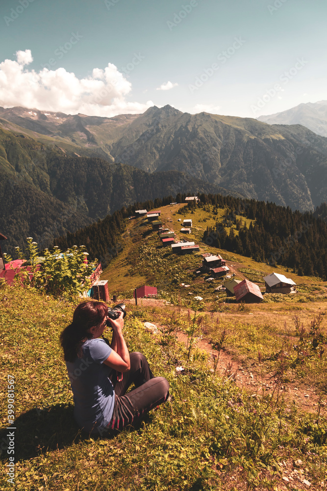 A tourist taking a photo on the Pokut plateau, which borders Rize province in the Black Sea region of Turkey