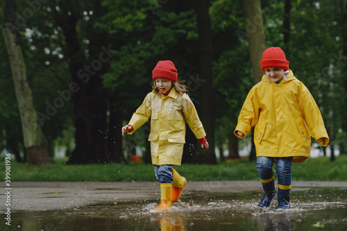 Fototapeta Naklejka Na Ścianę i Meble -  Kids in a puddle. Child having fun outdoors.