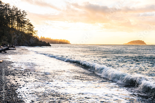 sunset on the beach with waves crashing