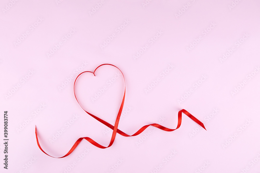 Valentine day greeting card. Red heart-shaped ribbon on a pink background.