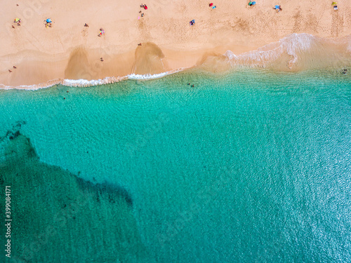 Aerial view of the jagged shores and beaches of La Graciosa island. Bathers on the beach of las Conchas. The main archipelago island Chinijo, a mile northwest of Lanzarote. Canary island. Spain. Ocean photo