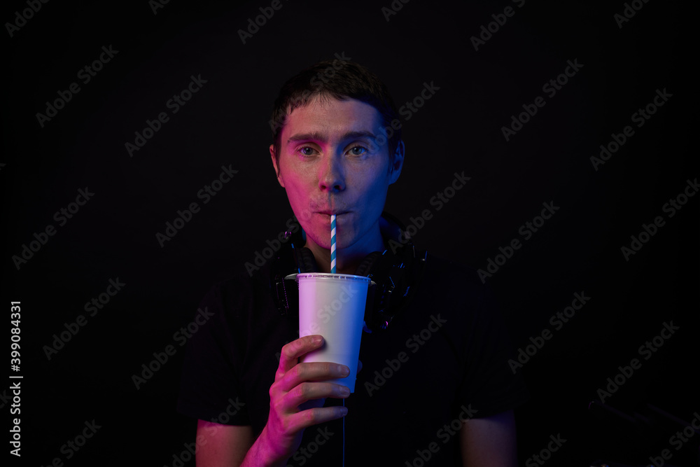 Gamer is drinking cola. Concept of virtual reality, games, entertainment and communication.