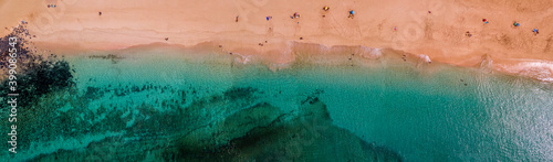 Aerial view of the jagged shores and beaches of La Graciosa island. Bathers on the beach of las Conchas. The main archipelago island Chinijo, a mile northwest of Lanzarote. Canary island. Spain. Ocean photo