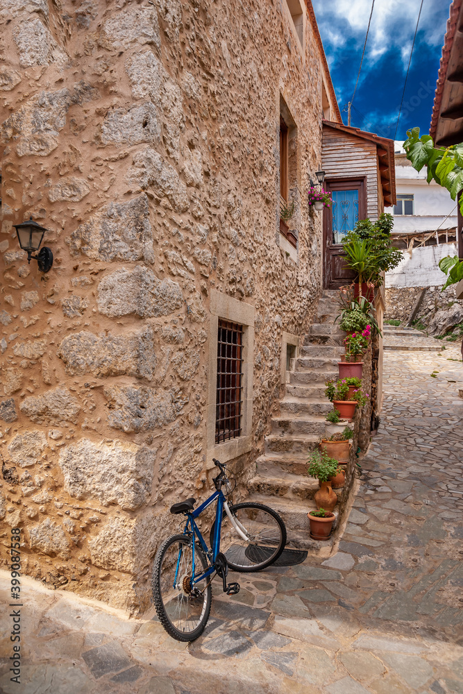 Bicycle near the door of a stone house