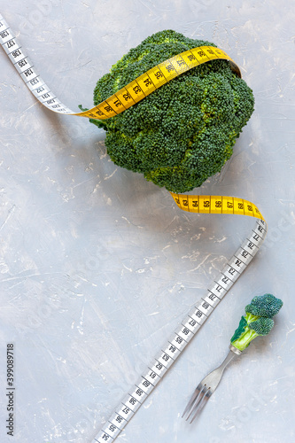  Broccoli and centimeter. Fresh egetable, concept for weight loss, diet, ketogenic diet, intermittent fasting. photo