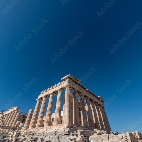 Parthenon ancient temple east front, standing on Acropolis hill Athens Greece, space for your text © Dimitrios