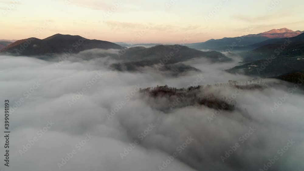 Flying through the clouds at dawn above the jumping lake in Rieti Flying through the clouds at dawn above the jumping lake in Rieti