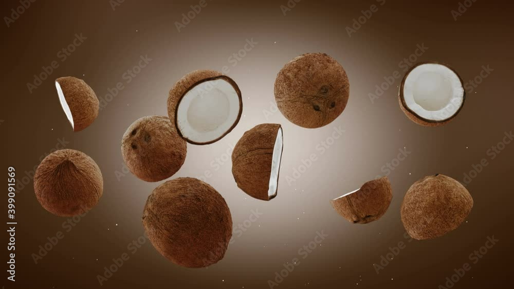Flying of Coconuts and Slices in brown Background. Speed up and falling down coconuts with green screen. Professional slow motion 4K animation.