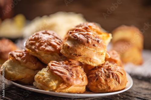 Slovak pagace, Serbian or Croatian pogace, or Hungarian pagacsa crispy bread buns stacked on a plate