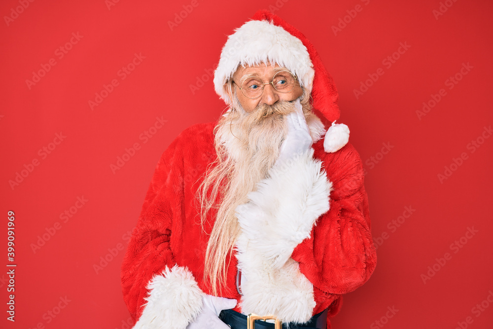 Old senior man with grey hair and long beard wearing traditional santa claus costume touching mouth with hand with painful expression because of toothache or dental illness on teeth. dentist