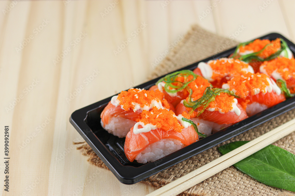 Salmon sushi on wooden background, Japanese style, Slices of raw salmon fillet, Copy space. Salmon sushi on wooden background, Japanese style, Slices of raw salmon fillet, Copy space.