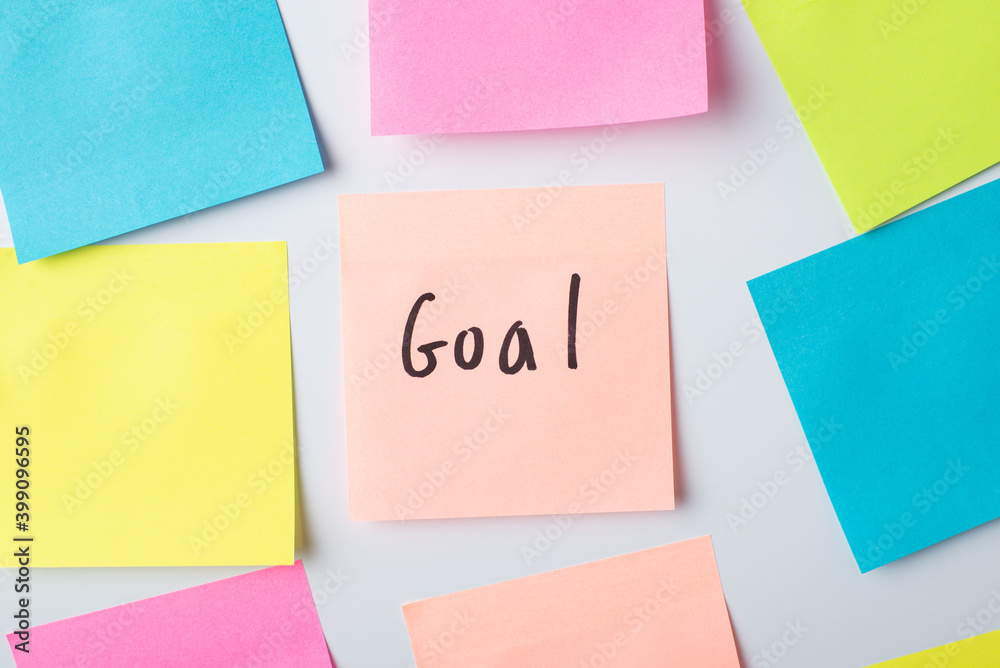 Paper with inscription Goal on the wall