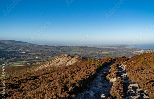 View of Great Sugar Loaf in Ireland. Irish Landscape.. The mountain is in the far northeastern section of the Wicklow Mountains, in Ireland, and overlooks the village of Kilmacanogue. photo