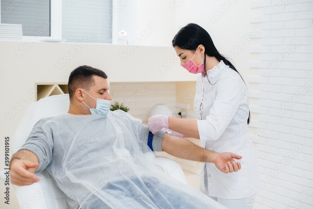 A man's blood is taken from a vein for analysis and testing for viruses. The formation of the immune system and antibodies. A man's blood is taken from a vein for analysis and testing for viruses. The formation of the immune system and antibodies.