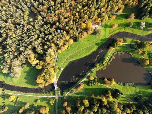 Photography autumn park with paths and lakes ponds