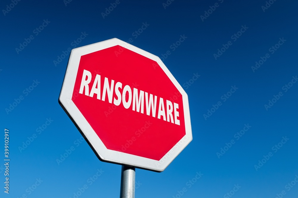 Stop sign with a text RANSOMWARE to cease malware attacks and protect against them Stop sign with a text RANSOMWARE to cease malware attacks and protect against them