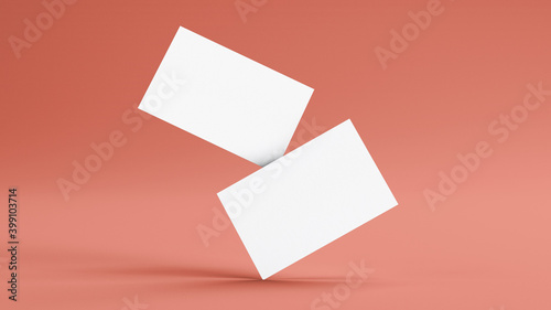 Two floating business cards mockup on a pink background. Insert your design. Branding concept