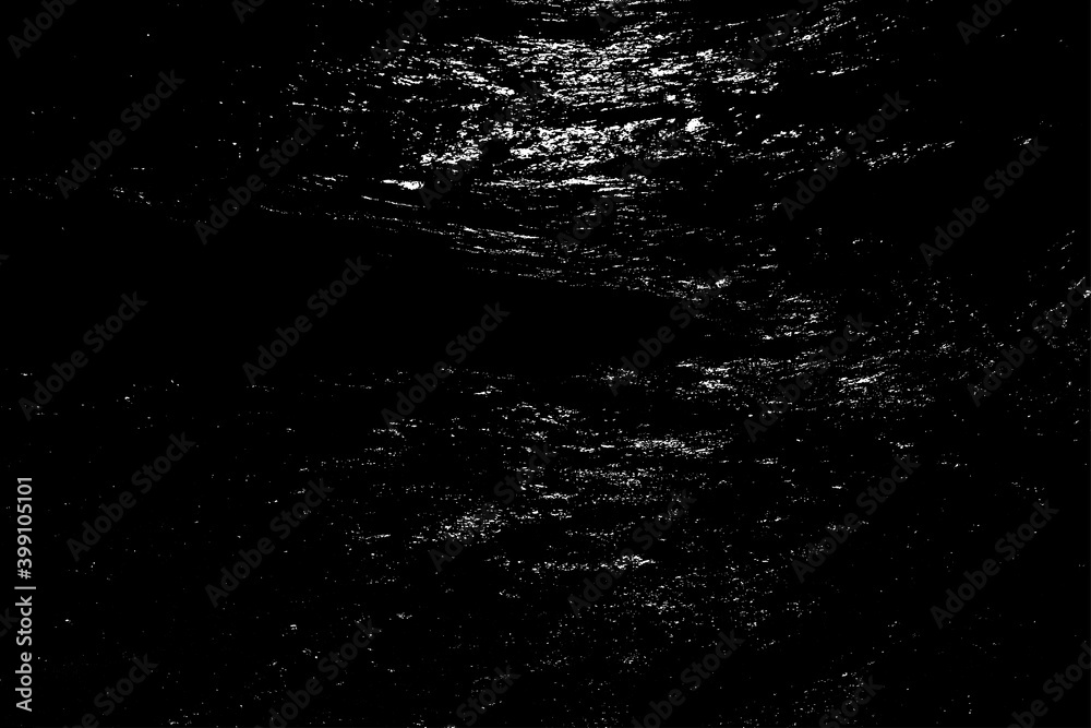 Night ripples of the ocean shiny surface. Reflection of moonlight in the dark abyss of waters. Dangerous sea depth for background. Gloomy stormy massive tide on the coast.Deep black vintage surf beach