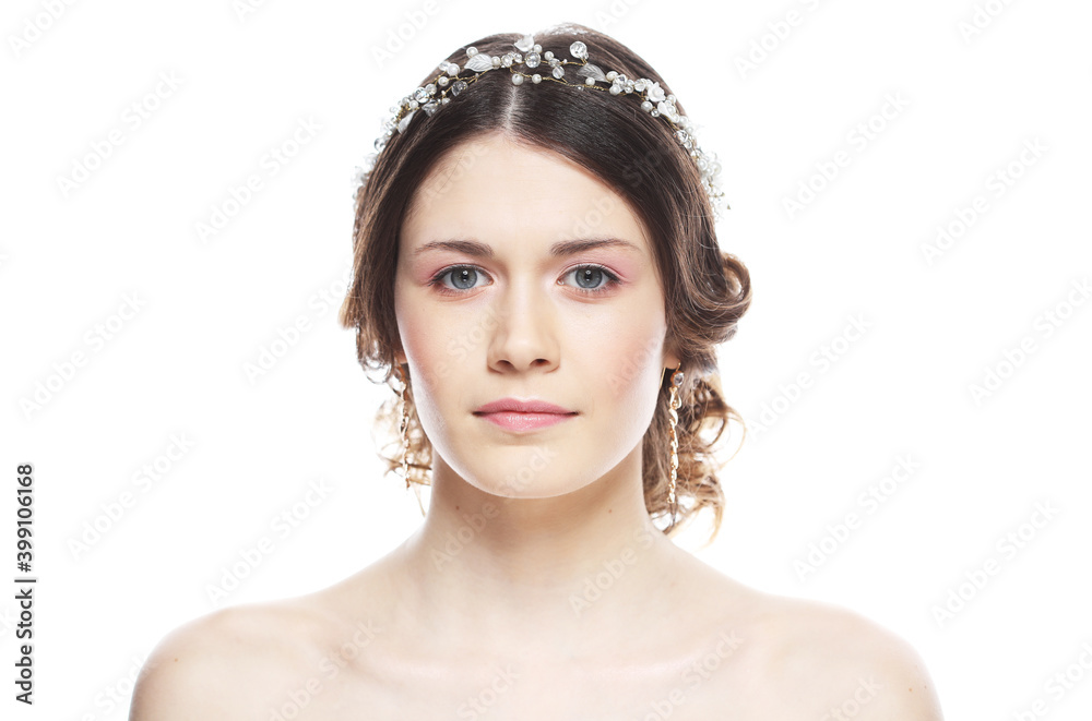 Young bride with gorgeous diadem in her hair, close up over pink background Young bride with gorgeous diadem in her hair, close up over pink background
