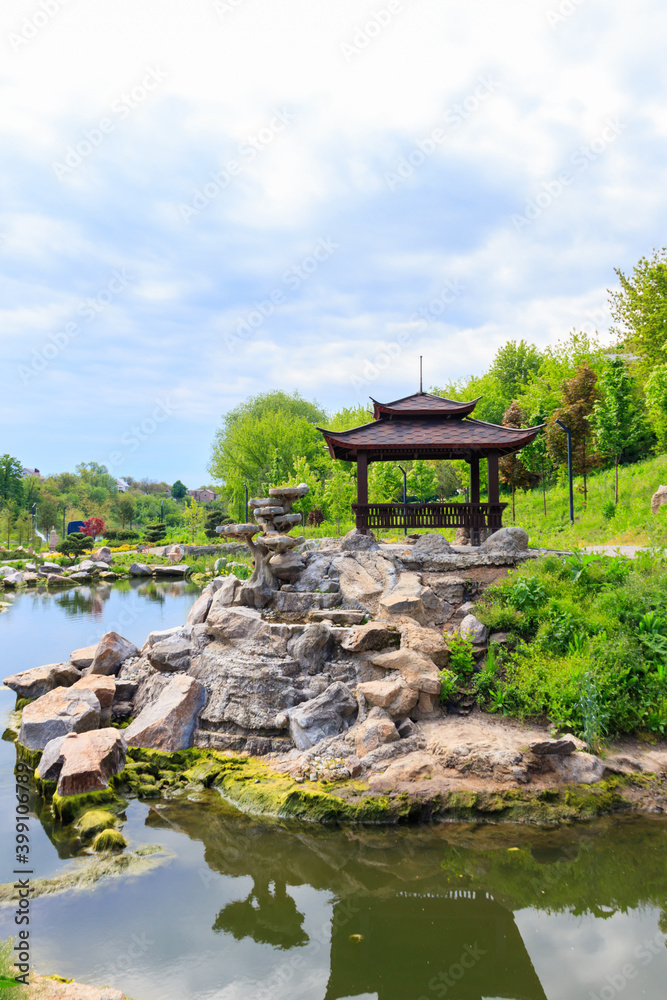 Beautiful japanese gazebo by a pond in Japanese garden