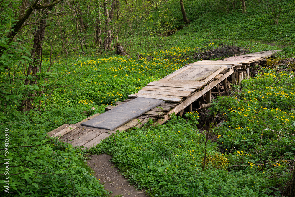 Old wooden bridge with their hands in the village in a poor country Old wooden bridge with their hands in the village in a poor country
