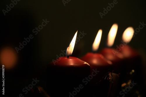 close up of an Advent arrangement with four burning candles