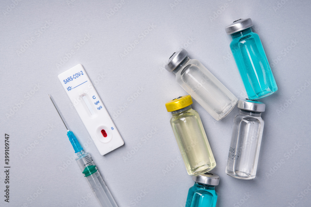 Coronavirus vaccine with syringe for injection and rapid test to detect virus infection Coronavirus vaccine with syringe for injection and rapid test to detect virus infection