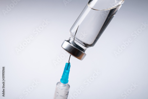 Closeup of glass bottle with coronavirus medication