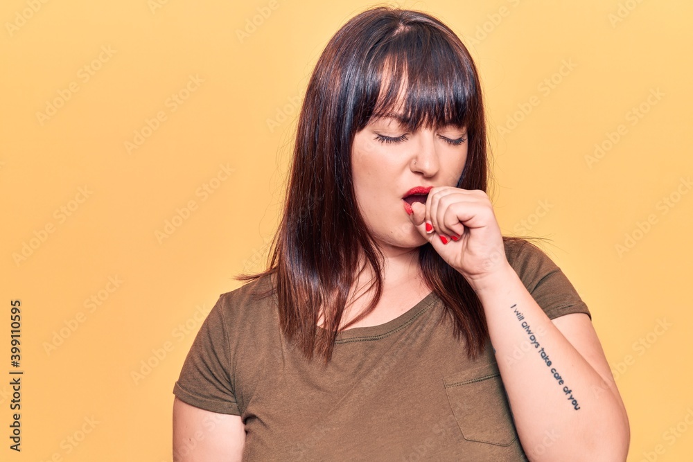 Young plus size woman wearing casual clothes feeling unwell and coughing as symptom for cold or bronchitis. health care concept. Young plus size woman wearing casual clothes feeling unwell and coughing as symptom for cold or bronchitis. health care concept.