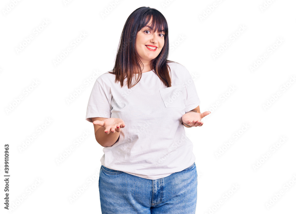 Young plus size woman wearing casual clothes smiling cheerful with open arms as friendly welcome, positive and confident greetings Young plus size woman wearing casual clothes smiling cheerful with open arms as friendly welcome, positive and confident greetings