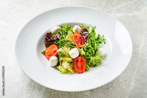 fresh salad with mozzarella and vegetables
