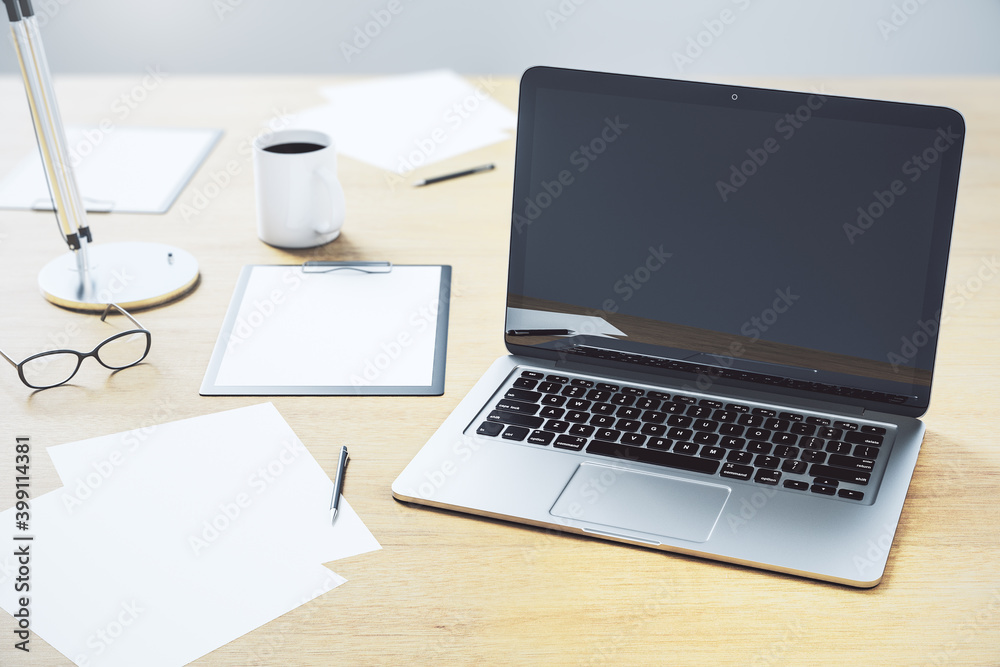 Fototapeta premium Office desktop with black screen laptop