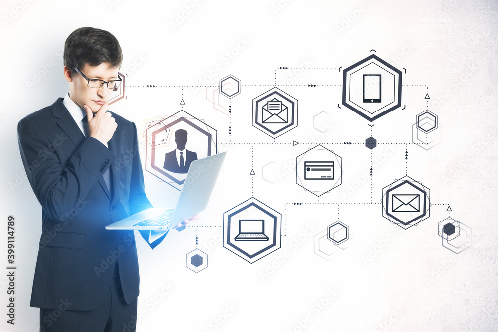 Businessman holding laptop and computer cloud diagram. Businessman holding laptop and computer cloud diagram.