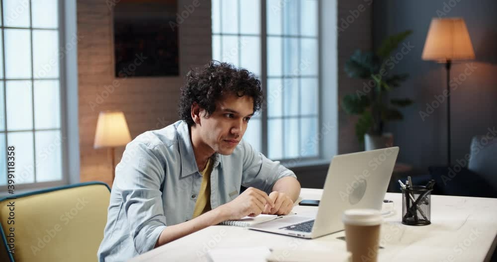 Positive young asian man having an online video conference. Remote worker talking to colleagues during team building video chat. Student chatting with friends 4k footage Positive young asian man having an online video conference. Remote worker talking to colleagues during team building video chat. Student chatting with friends 4k footage