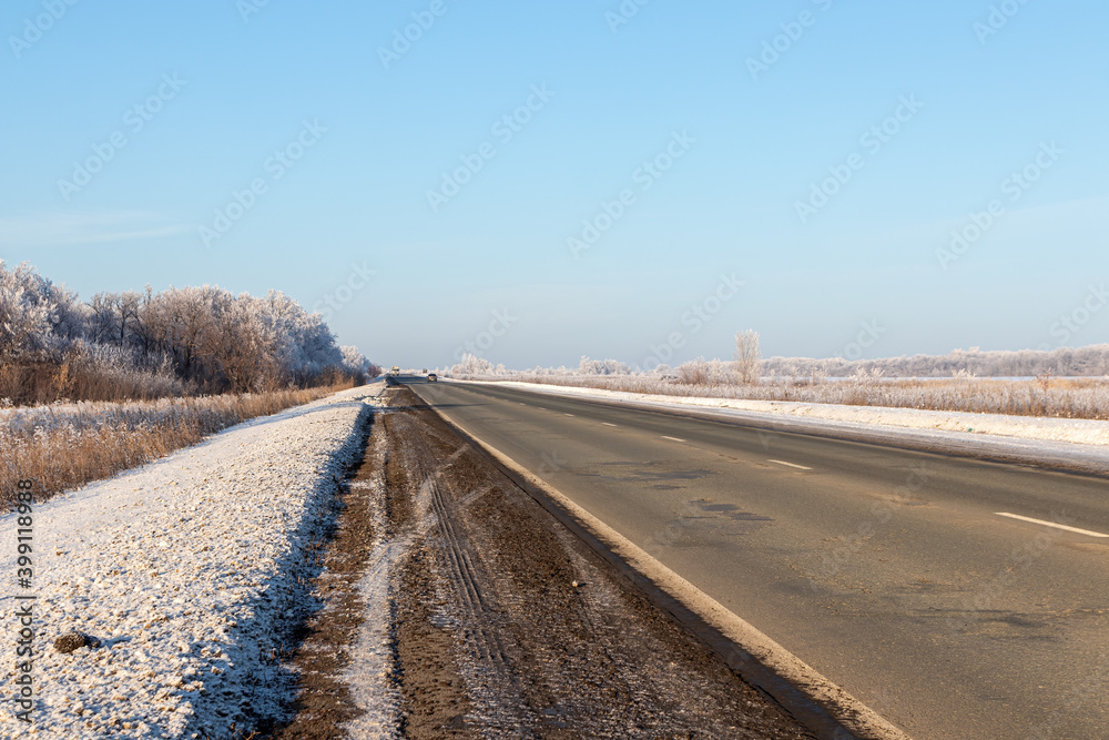 Two-lane road on a sunny December day in Russia