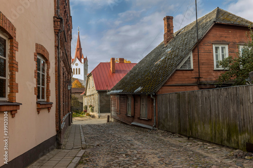 Fototapeta Naklejka Na Ścianę i Meble -  Empty cobblestone streets and church tower in the small town of Cesis, Latvia