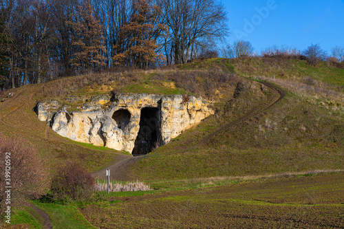 The Duivelsgrot (English: devils cave) in the Jekervallei (English Jekervalley) close to Maastricht on a sunny autumn day in December.  This cave is a landmark in the scenery and well known.  photo