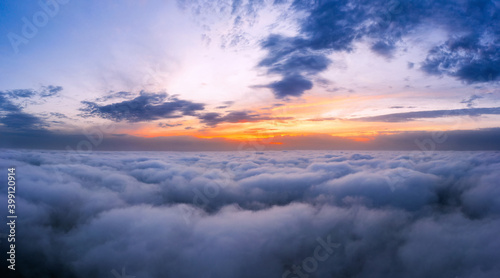 Photography Sunset sky above the clouds from aerial view.