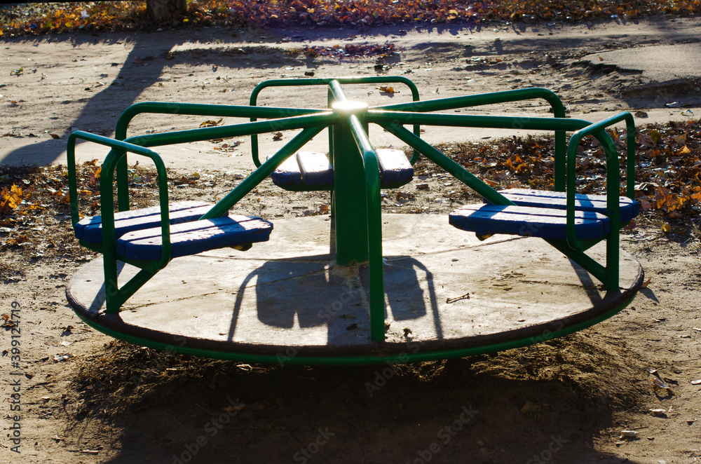 The blue and green children's carousel The blue and green children's carousel