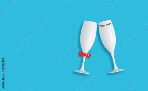 Creative concept with two Champaign glasses on pastel blue background