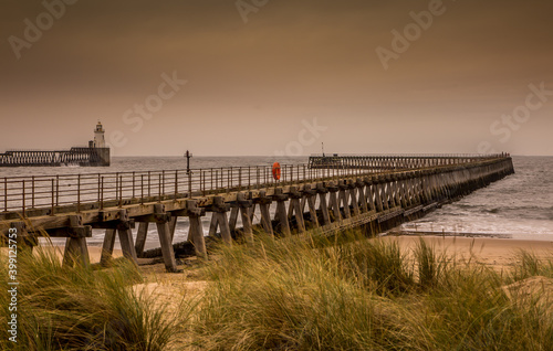 Morning at Blyth beach in Northumberland, England, with the old wooden Pier stretching out to the North Sea