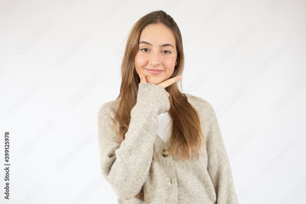 Image of thinking young woman smiling standing isolated over white background. Looking happy